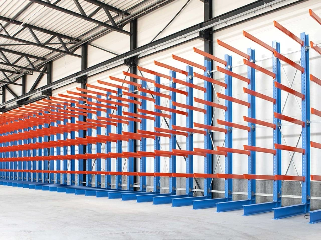 Cantilever racking system against a warehouse wall